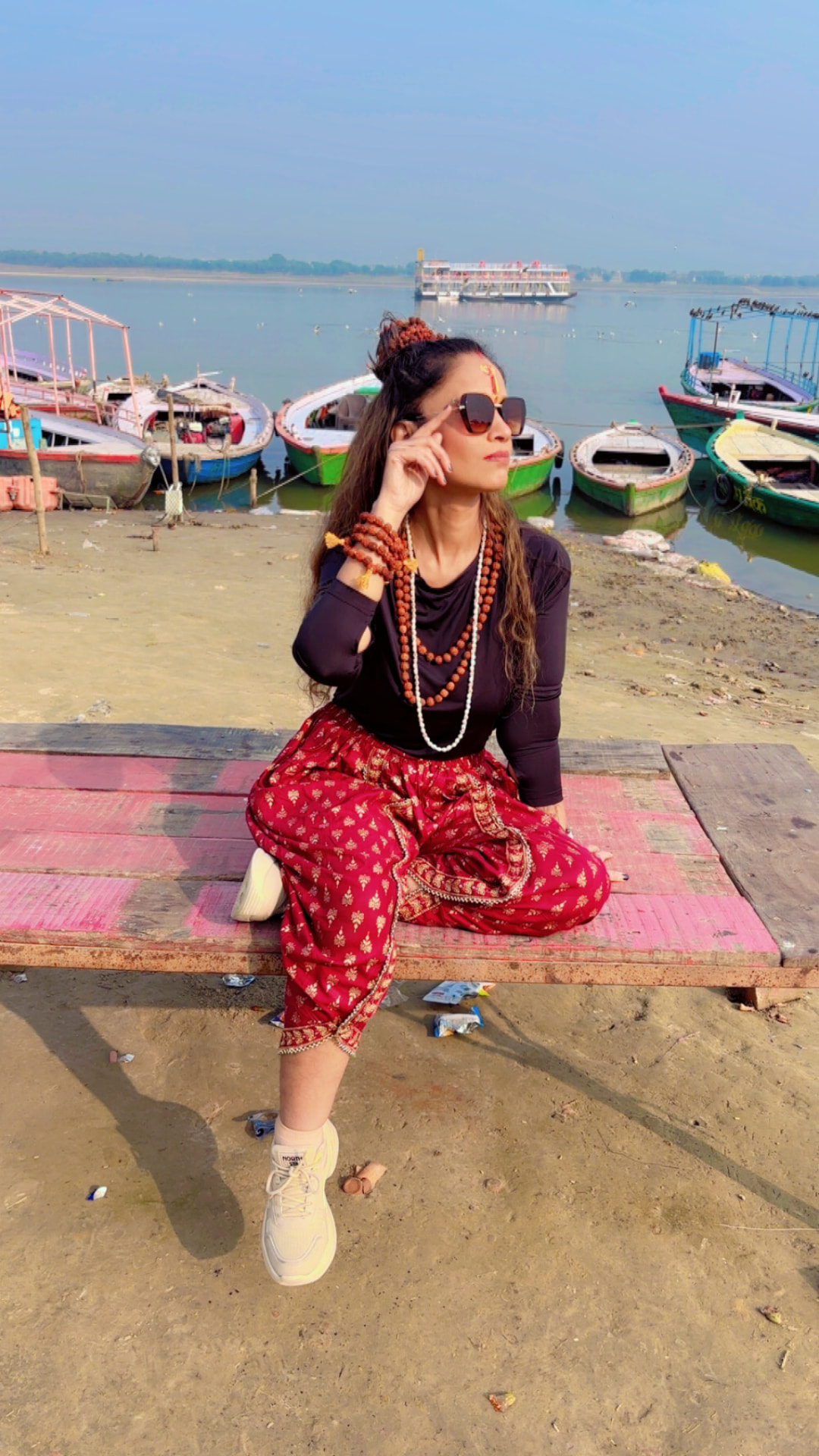 Suhaila at the ghats, wearing rudraksha beads