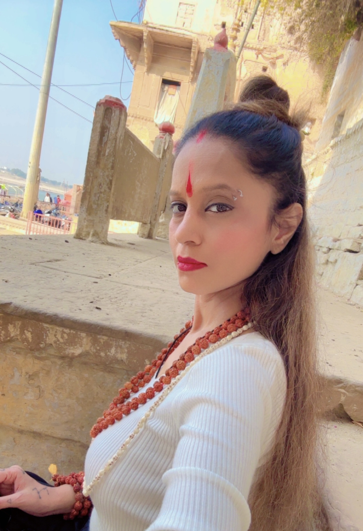 Suhaila in white with rudraksha beads
